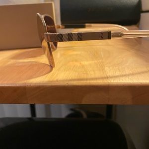 Woman’s Burberry aviator sunglasses.